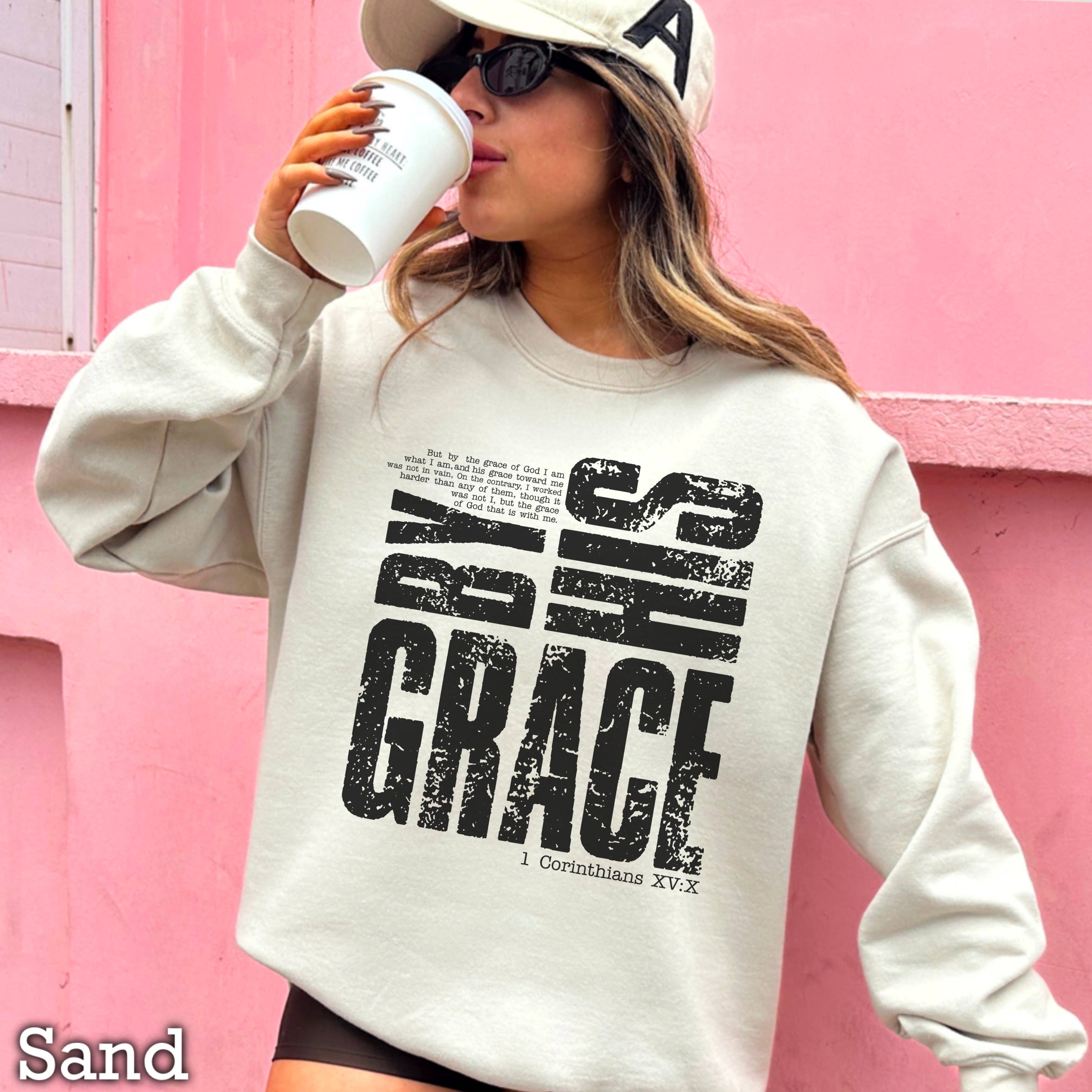 By His Grace Women’s Christian Graphic Sweatshirt: Sand / M